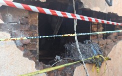 Police have cordoned off the house in Mayfair. eNCA/Hloni Mtimkulu