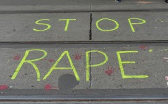 ''Stop rape'' is written on the road by protesters. Debarchan Chatterjee/NurPhoto via AFP