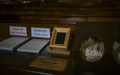 A Point of Sale (POS) device (C) is pictured at the Catholic Church of St Dionysius the Areopagite in Athens. AFP/Aris Messinis