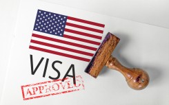 File: United States visa with flag. GettyImages/mirsad sarajlic