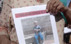 A poster with a photo of missing Mojalefa Savhuli.