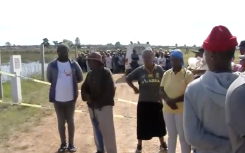 Community members on the scene where the body was discovered.