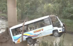 The bus being removed from the scene.