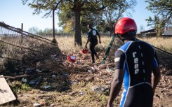 Search and rescue teams search for bodies washed up after a flood near Mthatha. AFP/Emmanuel Croset