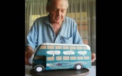 Artist, John Fann with one of his buses created from cereal boxes