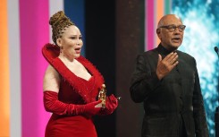 Lelelti Khumalo and Anant Singh receive an award at the Monte Carlo Television Festival