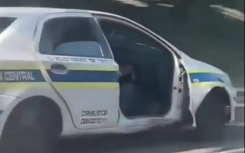 The police vehicle without a door.