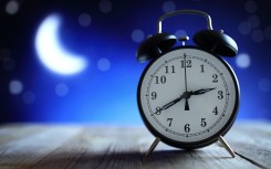 Alarm clock in the middle of the night. GettyImages/BrianAJackson