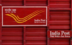 An India Post vehicle is pictured along a road in New Delhi. AFP/Sajjad Hussain