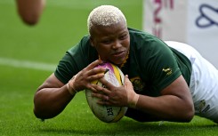 South Africa's Aseza Hele scores a try during the Women’s Rugby World Cup pool D match. AFP/Paul Ellis