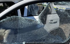 Shattered window of a vehicle Ian Cameron, Nicholas Gotsell and Lisa Schickerling were travelling in when they were attacked in Philippi, Western Cape 