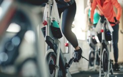 File: People working out with exercise bikes. GettyImages/gradyreese