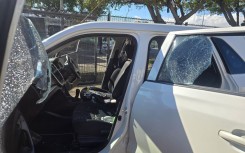  Shattered window of a vehicle Ian Cameron, Nicholas Gotsell and Lisa Schickerling were travelling in when they were attacked in Philippi, Western Cape