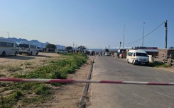 Police on the scene of the shooting at Macassar taxi rank. eNCA/Nobesuthu Hejana