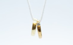 File: Wedding rings on a chain. Friso Gentsch/dpa via AFP