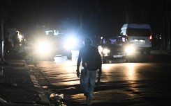 A man walks in the street during a power outage in Havana. AFP/Yamil Lage