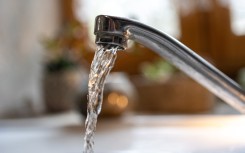 File: Water flowing from a kitchen tap. Isabelle Souriment/Hans Lucas via AFP
