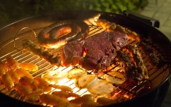 Boerewors and meat on braai stand