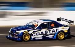 A motorsport vehicle dashes on a race course