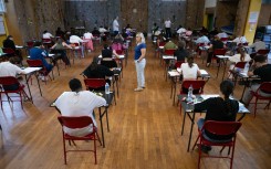 File: Pupils take part in an exam. AP/Sebastien Bozon