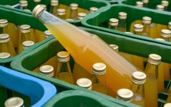File: Bottles of fruit juice. Patrick Pleul/dpa Picture-Alliance via AFP