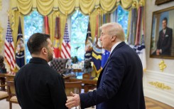 US President Donald Trump (R) speaks with Ukraine's President Volodymyr Zelensky (L) in the Oval Office. AFP/Ukrainian Presidential Press Service
