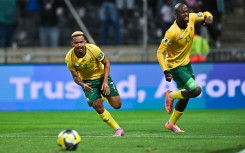 Oswin Appollis and Evidence Makgopa celebrating a goal for Bafana Bafana against Rwanda. 