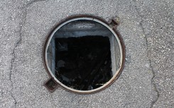 File: An open manhole. GettyImages/Jumbo2010