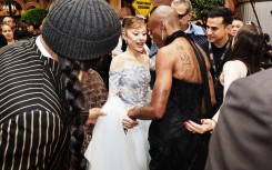 Ariana Grande (C) and Cynthia Erivo (2nd R) at the premiere of their film "Wicked: For Good" in Singapore. AFP/STR