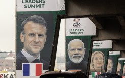 Banners of world leaders displayed on pillars of an highway overpass in Johannesburg. AFP/Gianluigi Guercia