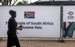 A banner featuring the South African flag and G20 logo at the Nasrec Expo Centre. AFP/Gianluigi Guercia