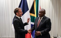 France’s President Emmanuel Macron (L) shakes hands with South Africa's President Cyril Ramaphosa (R) during their bilateral meeting at the Sandton Convention Centre in Sandton on November 21, 2025, ahead of the G20 leaders' Summit. 