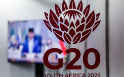 G20 logos are displayed at the media centre. AFP/Ludovic Marin