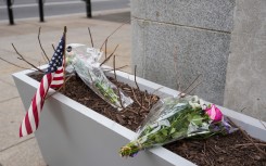 A small memorial of flowers and an American flag has been set up outside the Farragut West Metro station. Andrew Leyden/Getty Images/AFP