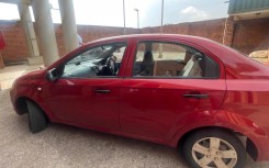 A red Chevrolet Aveo sedan belonging to Brown Mogotsi