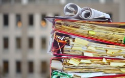 File: A stack of files in an office. GettyImages/thomas-bethge
