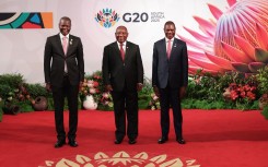 South Africa's G20 World Leaders Summit  Three generations of patriotic South Africans stand together beneath the vibrant King Prote. Photo GCIS