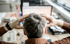 File: A stressed employee. Thomas Eisenhuth/dpa Picture-Alliance via AFP