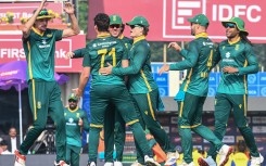 Nandre Burger (2L) celebrates with teammates. AFP/Dibyangshu Sarkar