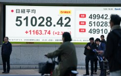 An electronic quotation board displays the Nikkei Stock Average closing price. AFP/Kazuhiro Nogi