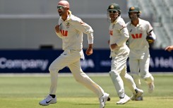 Australian bowler Nathan Lyon (L) celebrates dismissing England batsman Ben Duckett. AFP/William West
