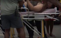 Image of male being rescued from a near-drowning experience at Baggies Beach in Durban.