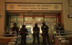 Armed police officers stand in front of the Metropolitan Detention facility in the Brooklyn borough of New York, where ousted president Nicolas Maduro is expected to be held. AFP/John Lamparski