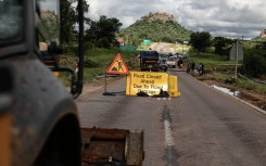 A sign indicating a closed road leading into Phalaborwa following heavy rains over much of Limpopo. AFP/Paul Botes