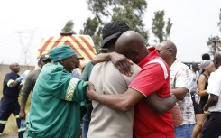 Parents and relatives react at the scene where a scholar transport vehicle crashed in Vanderbijlpark. Gallo Images/Sharon Seretlo