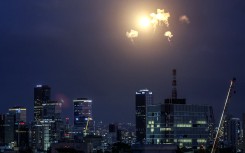 Explosions from projectile interceptions by Israel's Iron Dome missile defence system are pictured over Tel Aviv. AFP/Jack Guez