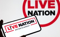 The Live Nation logo is displayed on a mobile phone with the company's branding. Jonathan Raa/NurPhoto via AFP