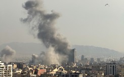 Plumes of smoke rise following reported explosions in Tehran. Mahsa/Middle East Images via AFP
