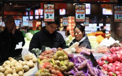 Citizens shop at a supermarket in Huai'an City, east China's Jiangsu Province. Zhou Changguo/IC photo/Imaginechina via AFP