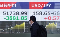 Electronic quotation boards displaying the Nikkei Stock Average (L) on the Tokyo Stock Exchange and the foreign exchange rate of the Japanese yen against the US dollar. AFP/Kazuhiro Nogi